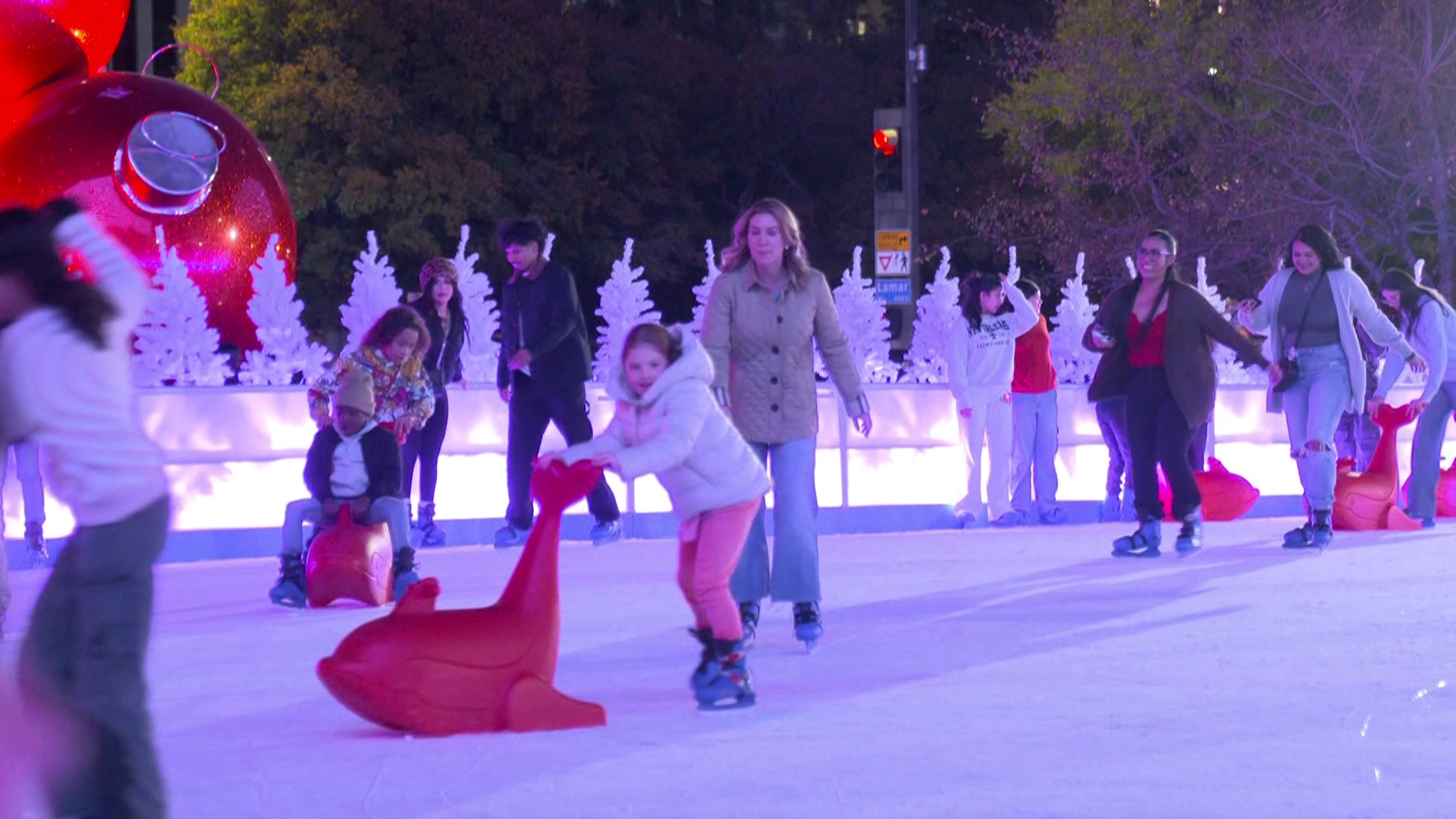 Kids skating with red seal skate aids